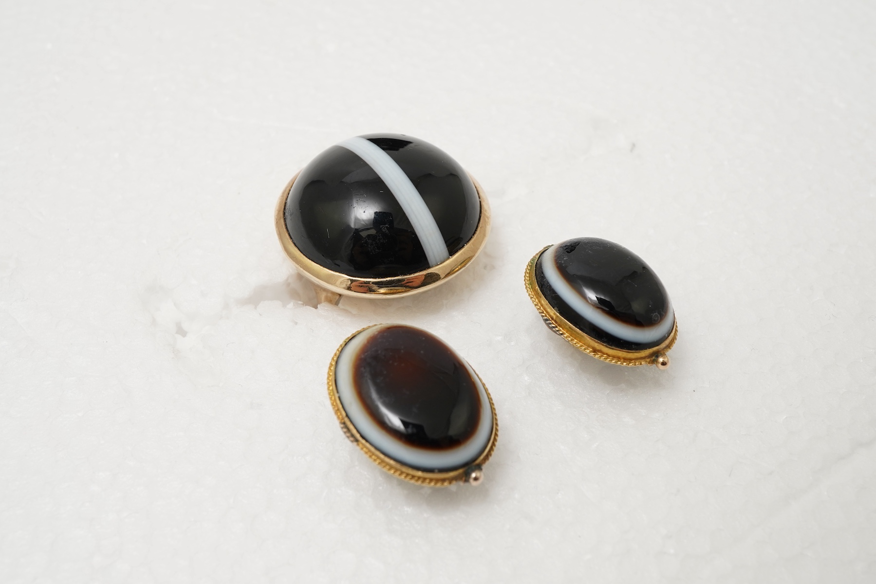 An onyx dress ring and pair of earrings